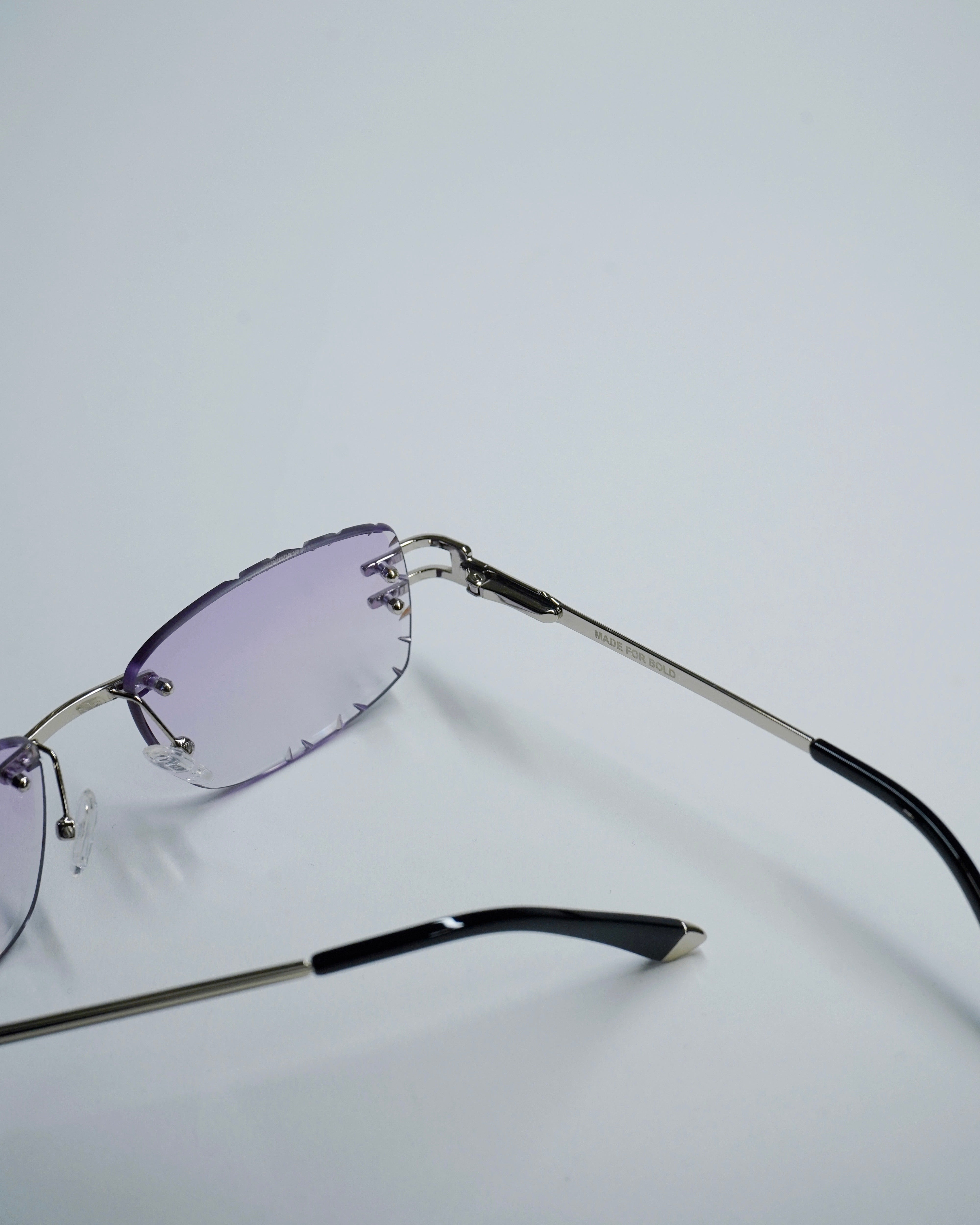 wfwh rimless glasses with purple lenses on a light gray background