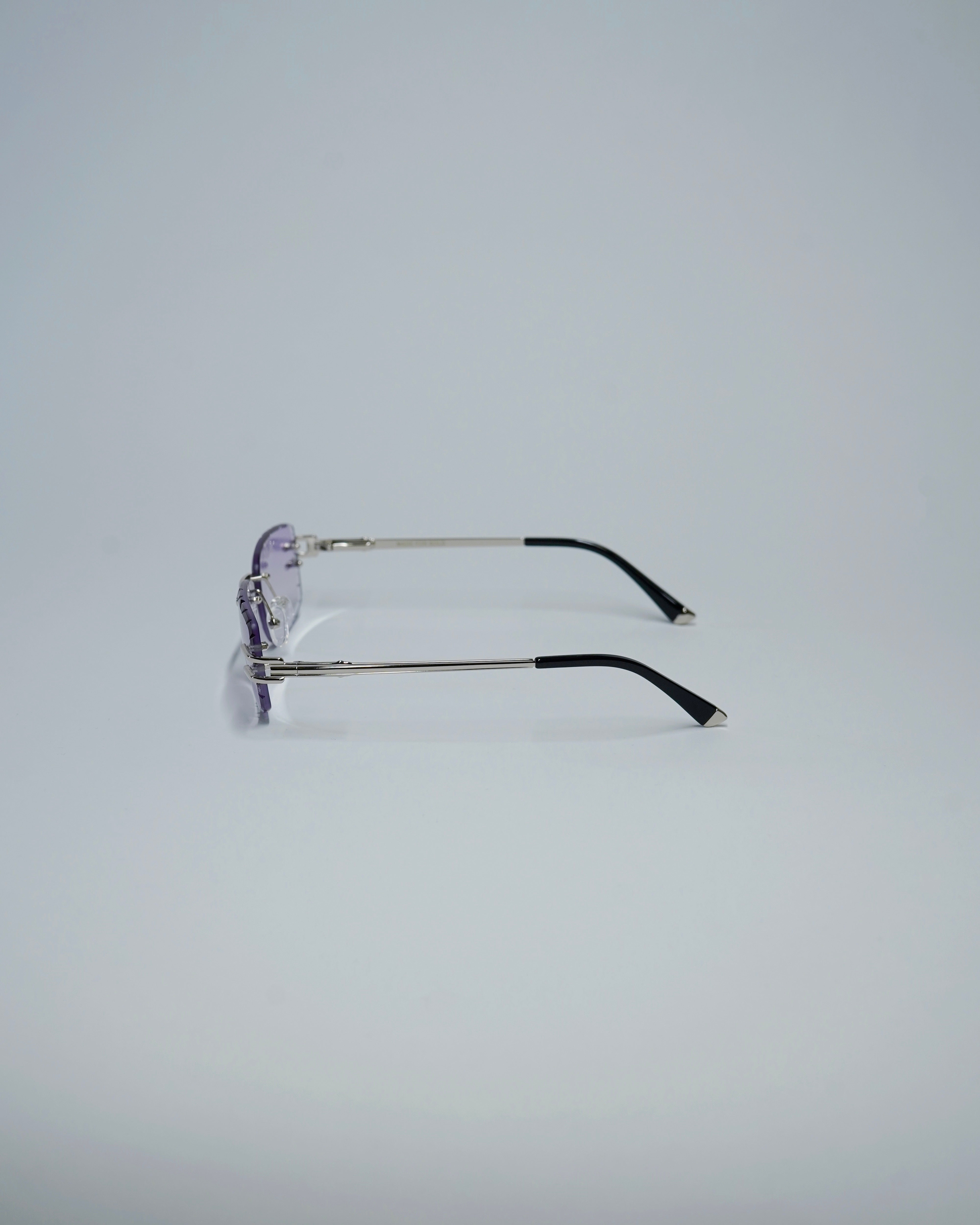 wfwh ocean glasses with thin metal frame on a light gray background
