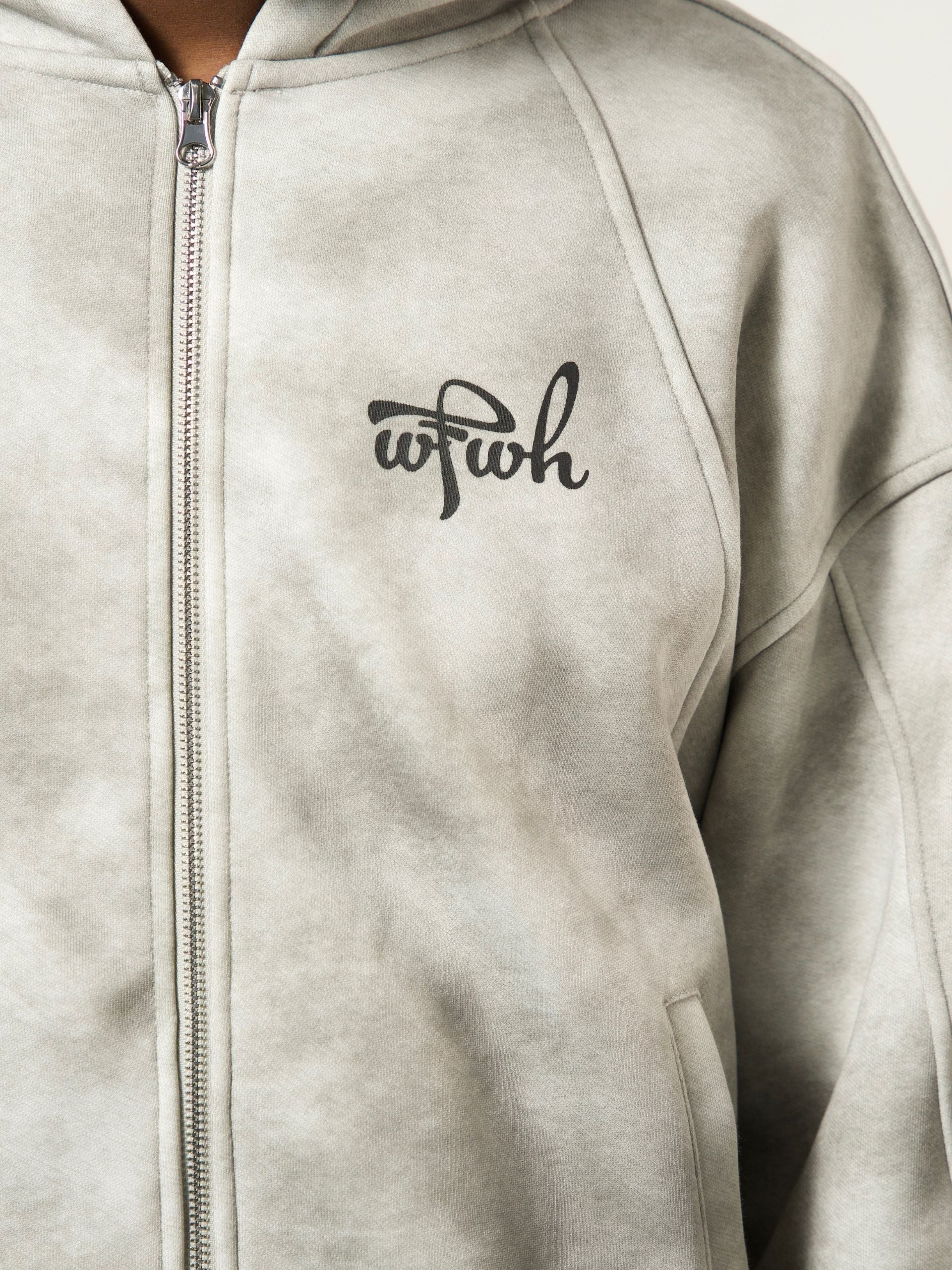 dust gray zipper with a wfwh logo on the chest